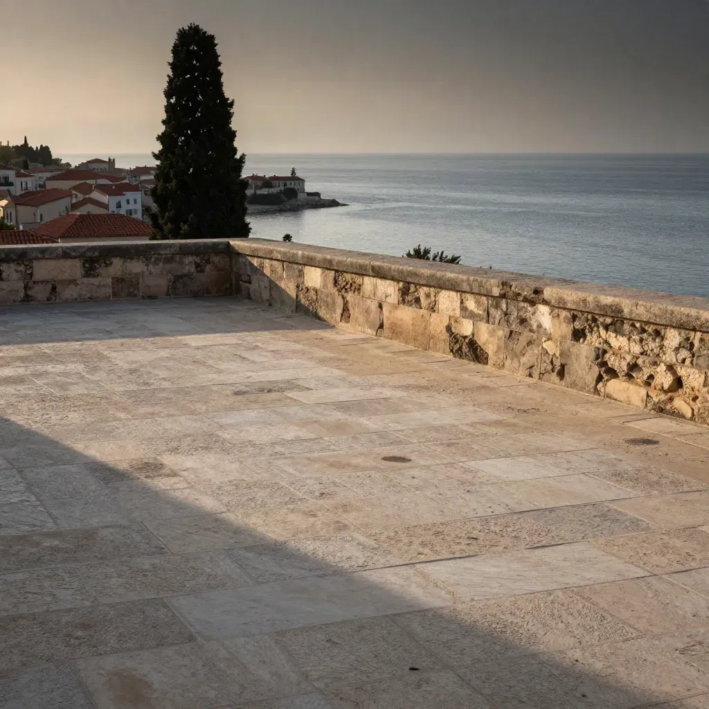 Golden coastal terrace above a distant town, cypress silhouette, sea haze, warm limestone light.